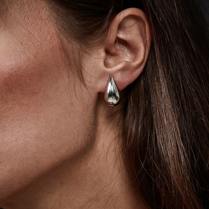 Donna pisara korvakorut