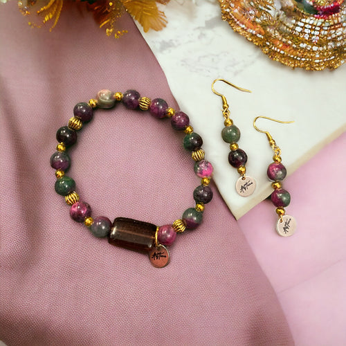 Lataa kuva 1. Käsirengas ja korvakorut Kirsikankukka