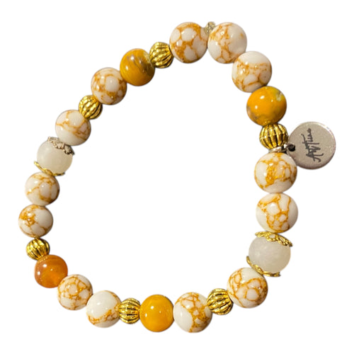 Lataa kuva 1. Rannekoru aidoilla kivillä